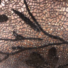 Mochila animal print de piel dorada y gris elegante